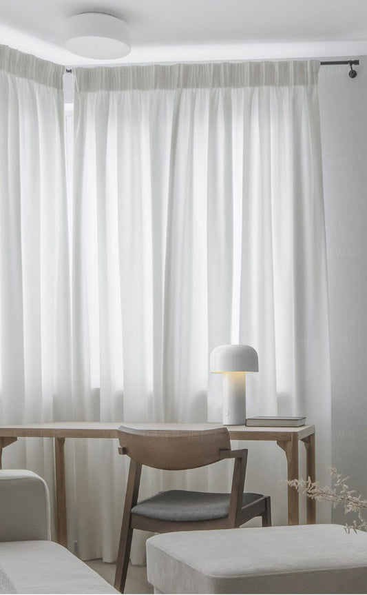 A Gentle Glow in a Minimalist Sanctuary: Elevate Your Workspace with the Bellhop Table Lamp