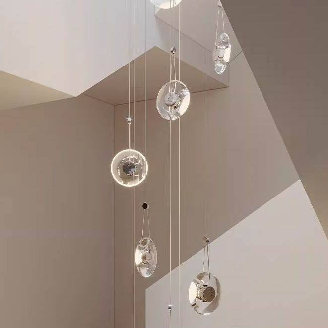 Modern minimalist luxury floating crystal chandelier | Minimalist artistic translucent disc design | Nordic style lighting fixture for living room, dining room, and staircase.