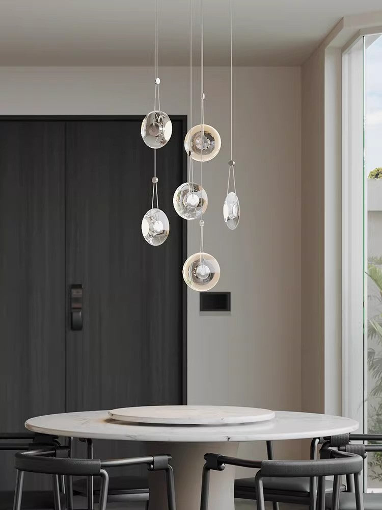 Modern minimalist luxury floating crystal chandelier | Minimalist artistic translucent disc design | Nordic style lighting fixture for living room, dining room, and staircase.