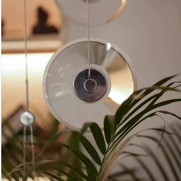 Modern minimalist luxury floating crystal chandelier | Minimalist artistic translucent disc design | Nordic style lighting fixture for living room, dining room, and staircase.