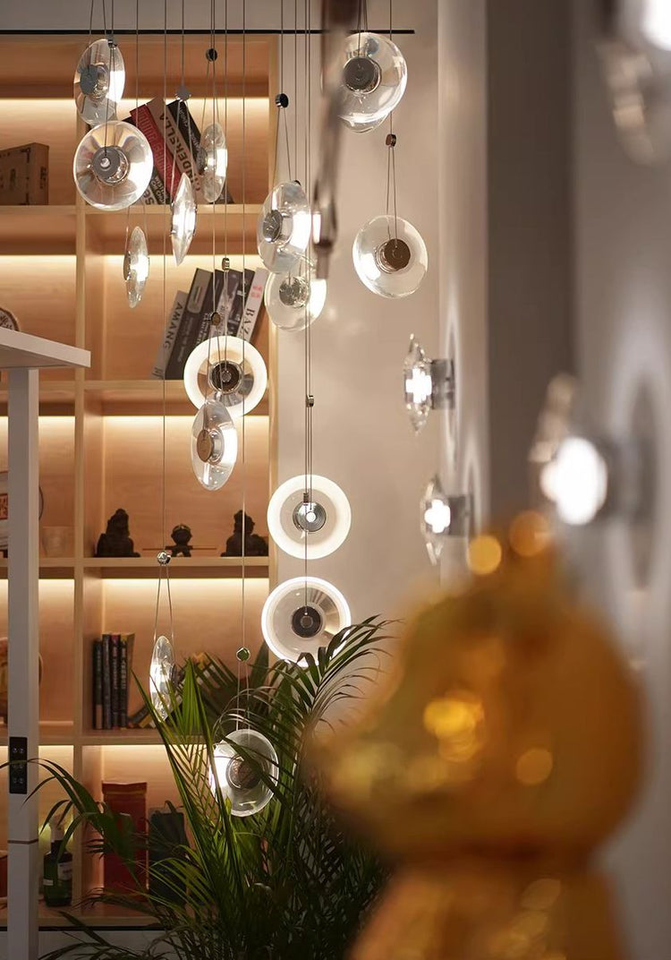 Modern minimalist luxury floating crystal chandelier | Minimalist artistic translucent disc design | Nordic style lighting fixture for living room, dining room, and staircase.